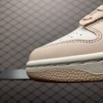 Dunk-Low-Orange-Pearl-Womens-1.jpg